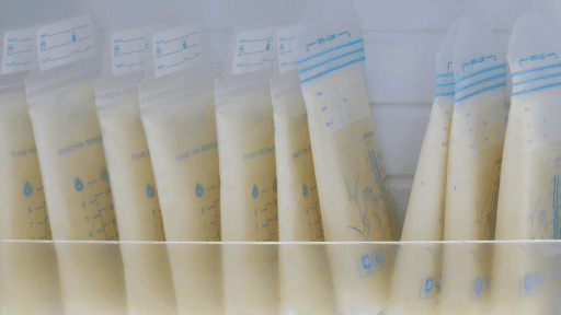 freezer bags of breast milk stacked vertically