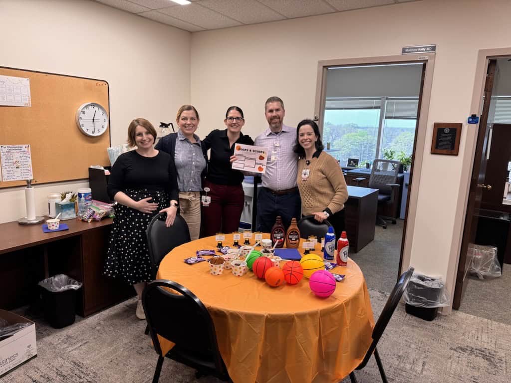 Infectious Diseases physicians pose for doctors day in front of an ice cream social