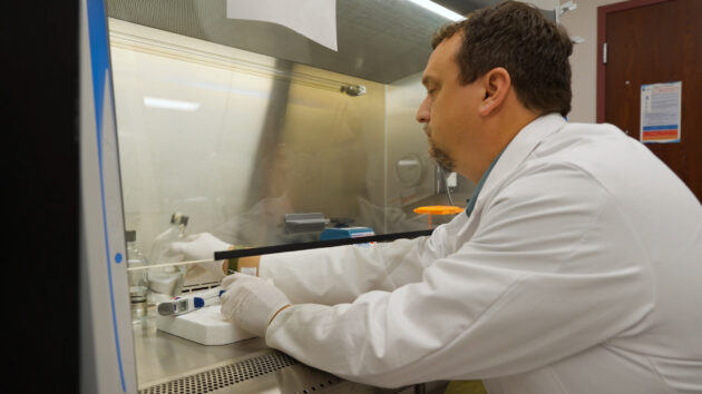 Dr. Josh Kennedy works in the research lab at the Arkansas Children's Research Institute (ACRI).