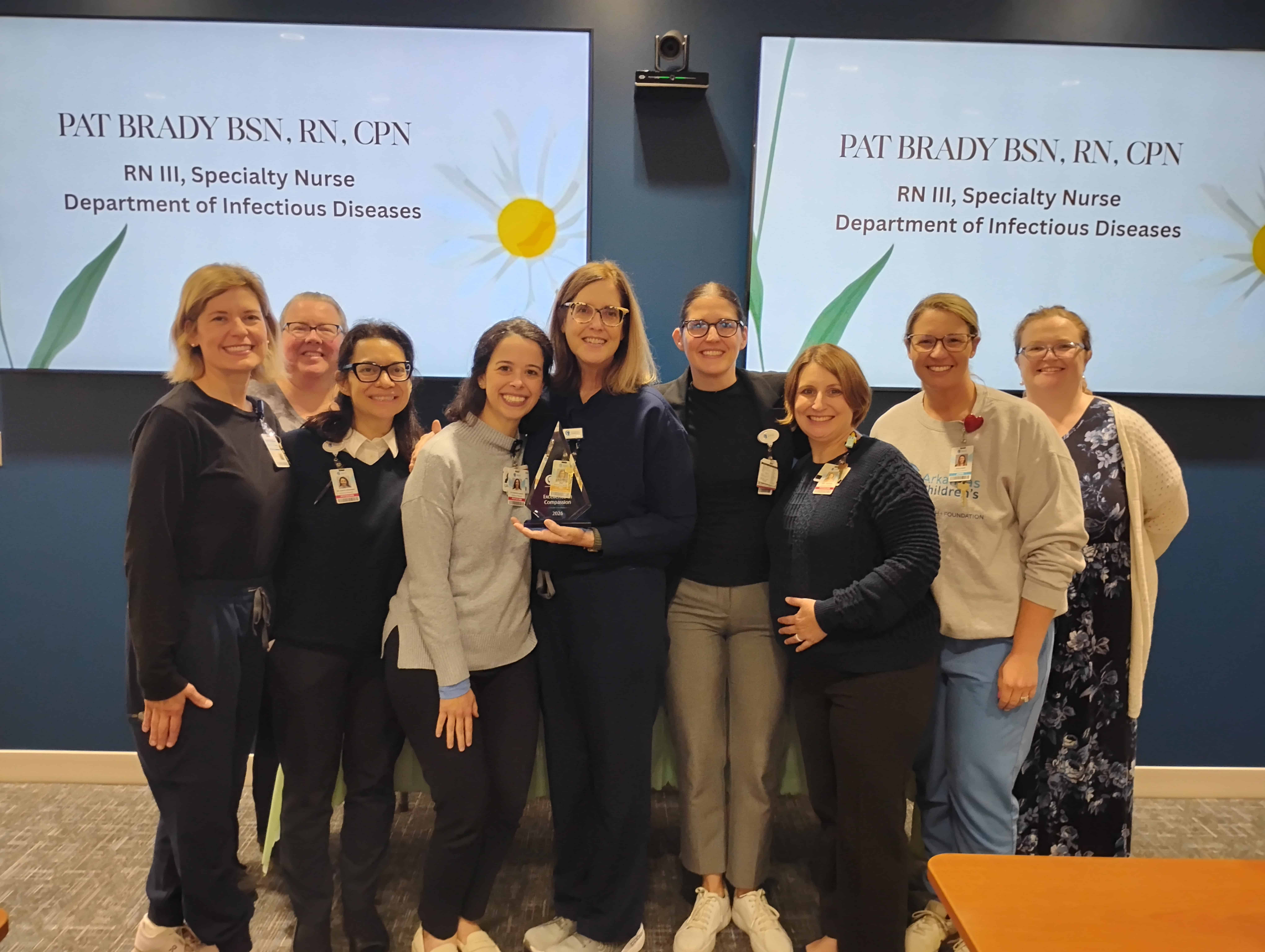 ID team posing with Pat Brady who won a nursing award