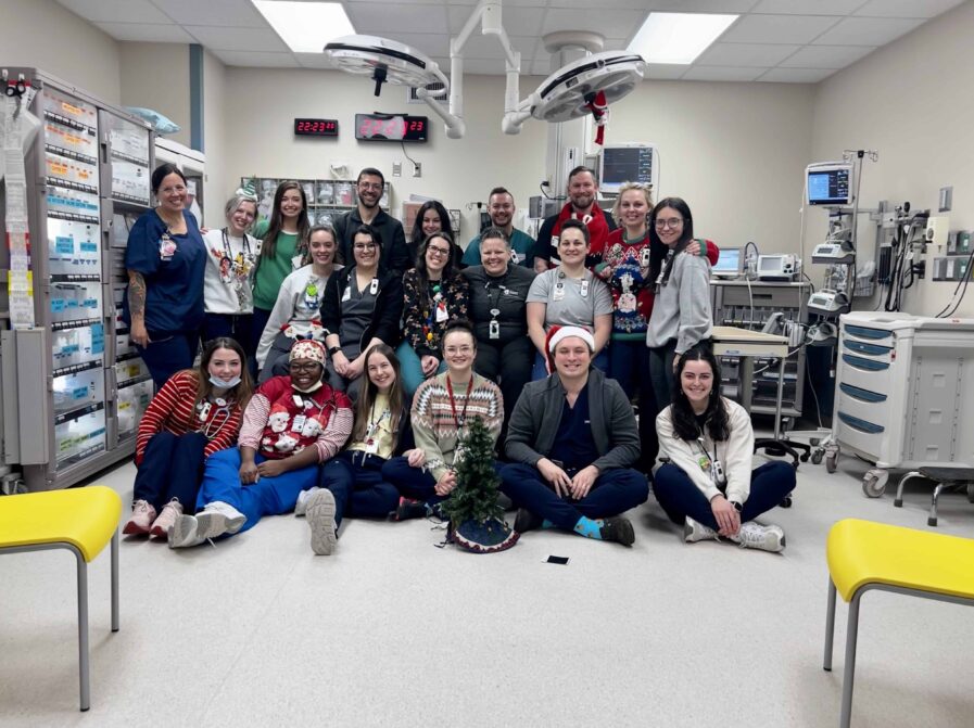 Members of the Pediatric Emergency Medicine team pose together for a photo in the emergency department at Arkansas Childrens