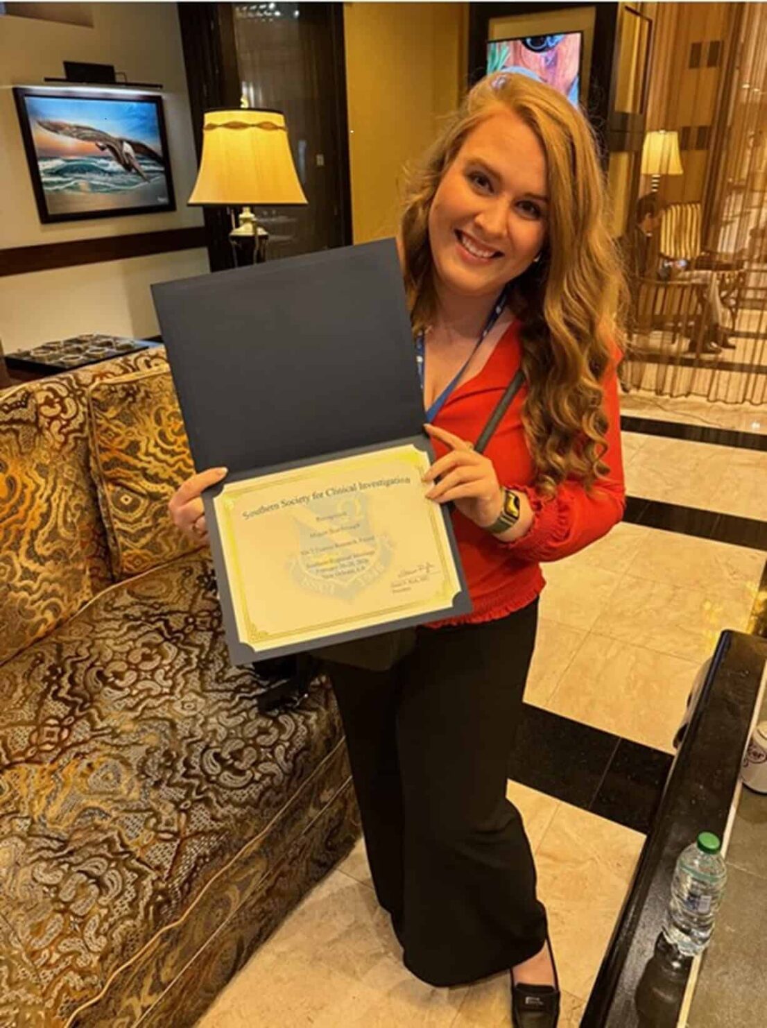 Dr. Megan Scarbrough shows off her award for clinical investigations from the Society for Pediatric Research.