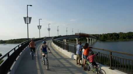 Cyclists and pedestrians enjoy an afternoon on the Big Dam Bridge