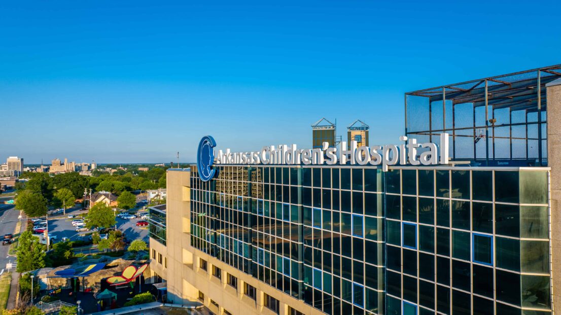 A bright blue sky frames the exterior of the Arkansas Children's Hospital in Little Rock Arkansas.