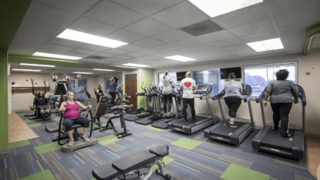 panoramic view with elliptical machines and weight equipment