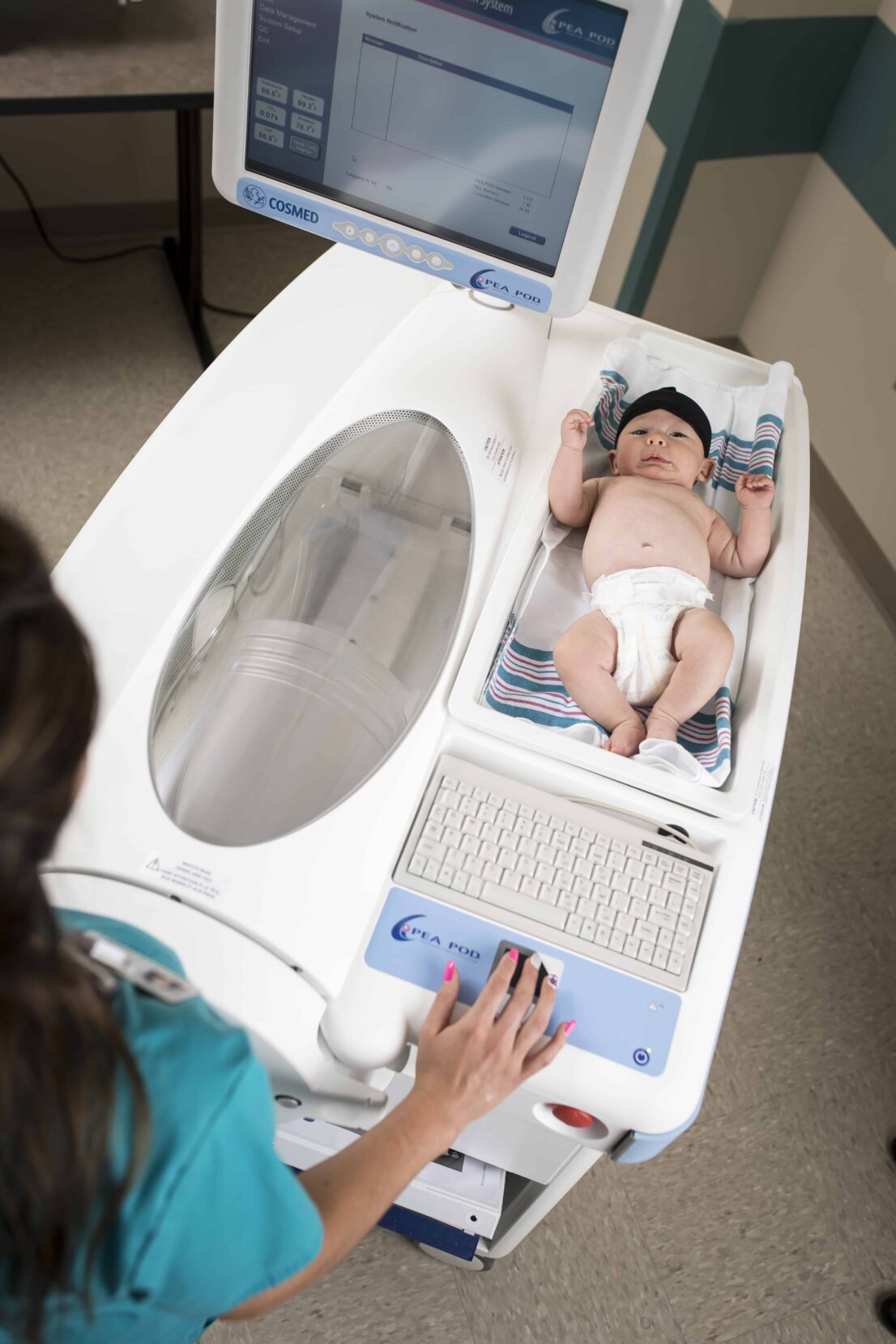 infant in peapod machine for scan to measure body composition