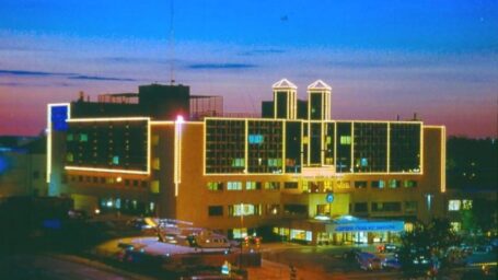 The Arkansas Children's Hospital at dusk. The exterior details of the hospital lined in lights