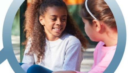 two girls talking and smiling