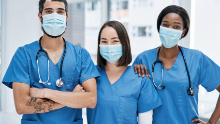 Portrait of a group of medical practitioners wearing face masks in a hospital