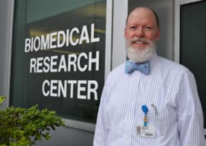 Dr. Philip Mayeux standing outside the Biomedical Research Center