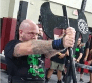 Dr. Fantegrossi holding an axe at competition