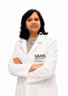 Debasree Bhadra in a white UAMS lab coat