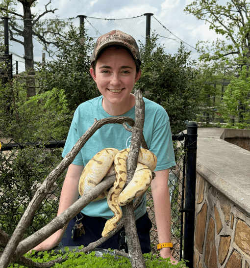 Photo of Research Technician Duo posed with a snake at local zoo