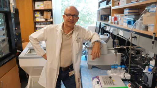 Dr. Roy Morello stands in his lab