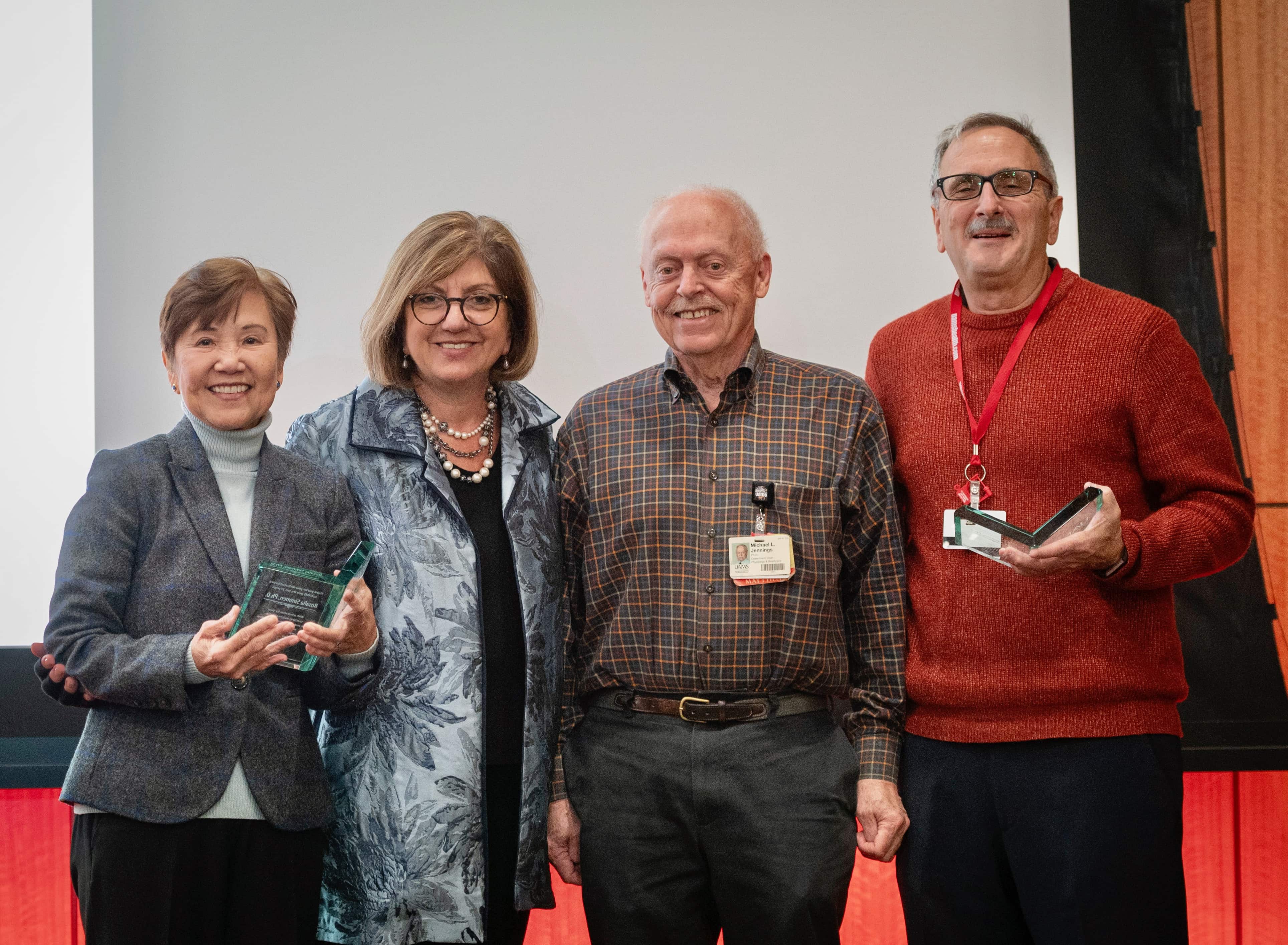 Dr. Bellido poses with Drs. Simmen and previous the previous Chair Dr. Jennings