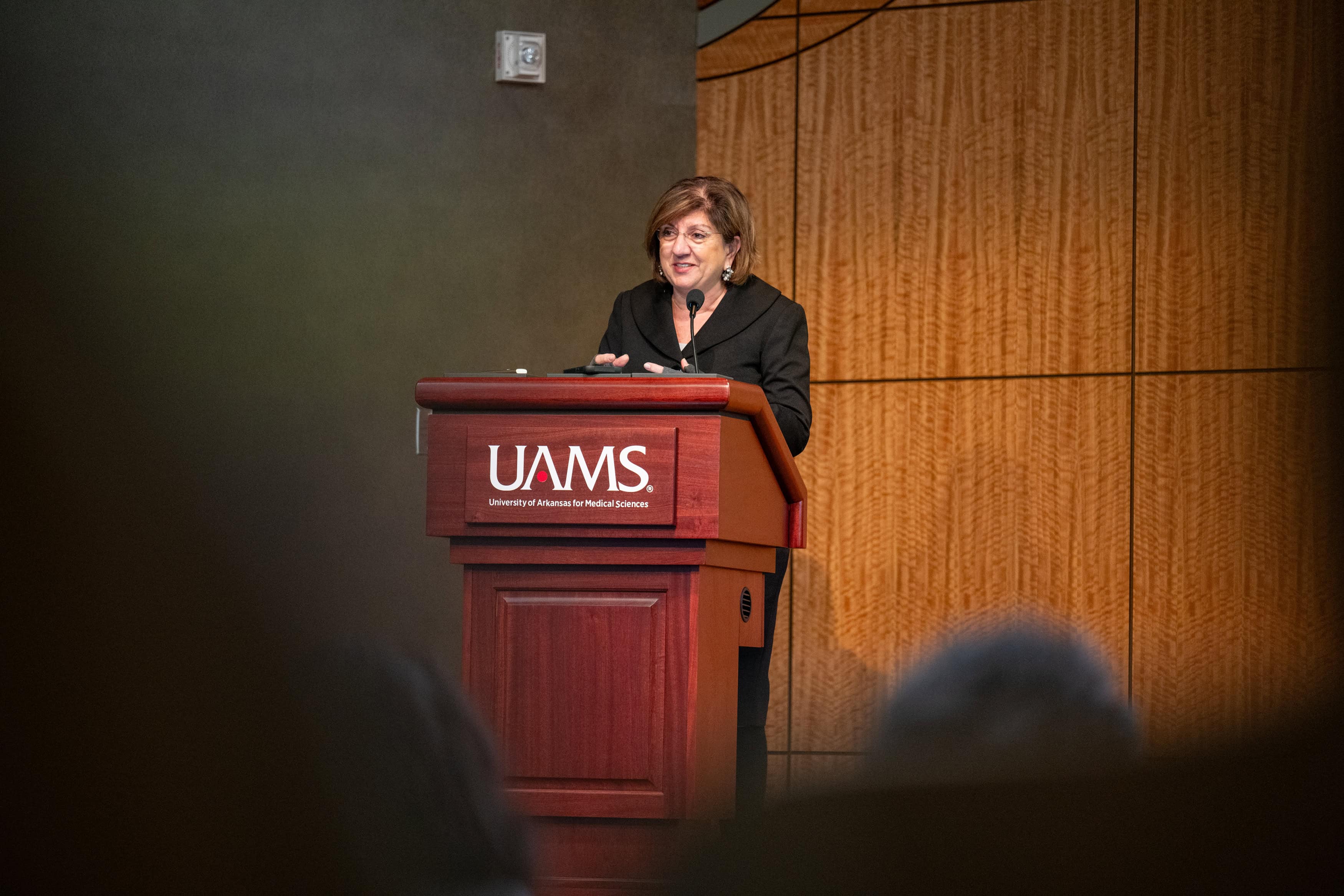 Dr. Bellido speaks from a lectern