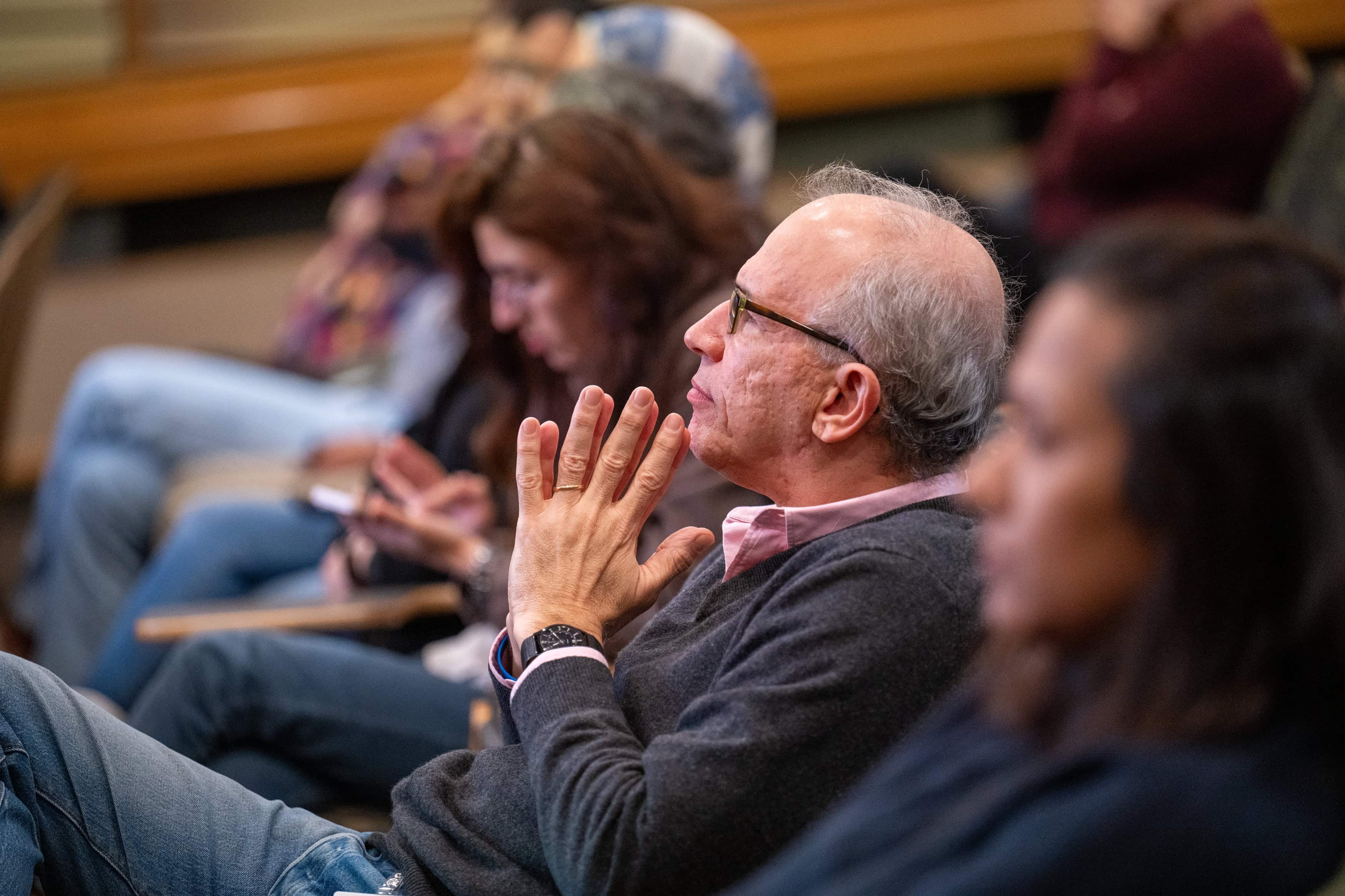 Faculty members listening in the audience