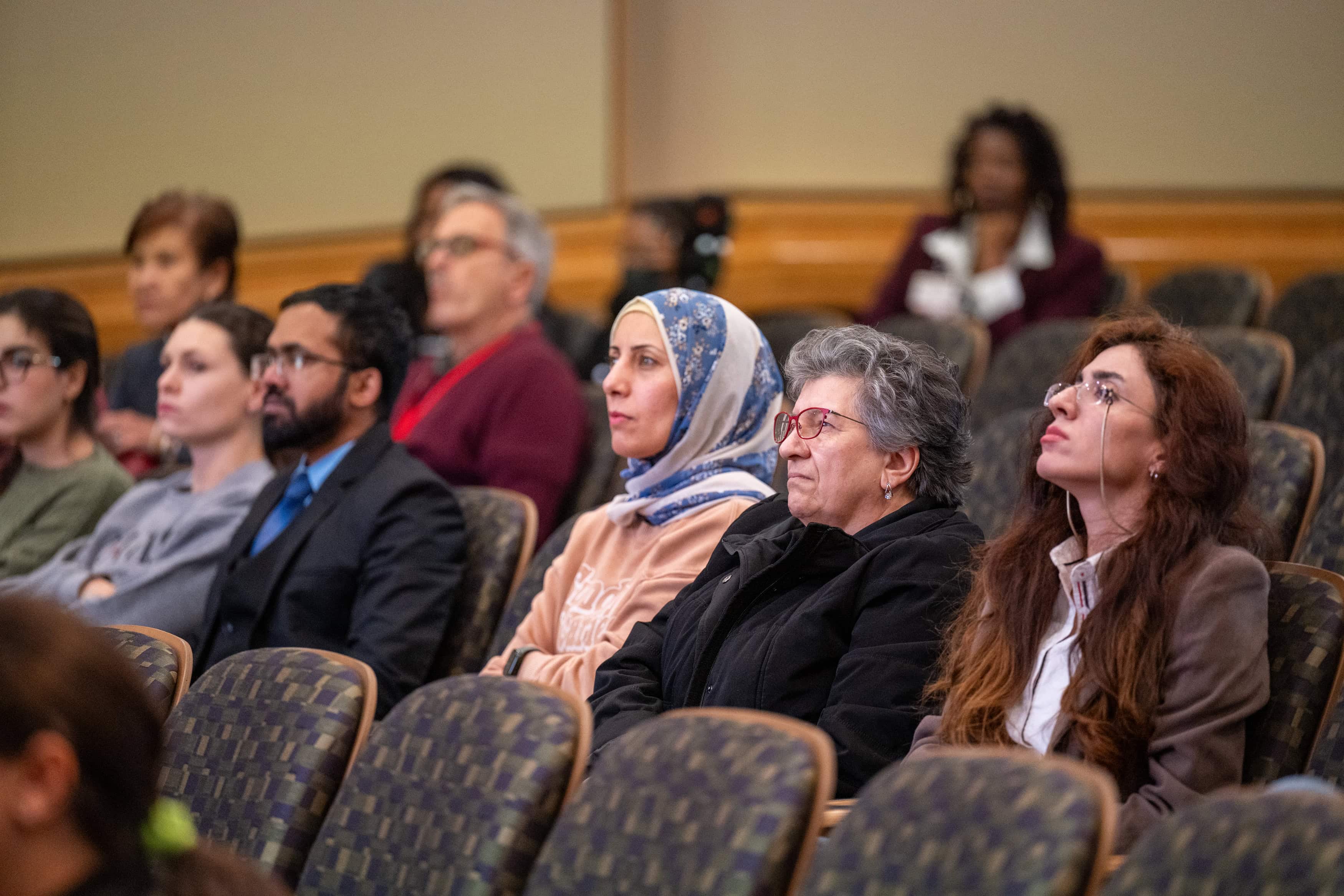 Faculty members listening in the audience