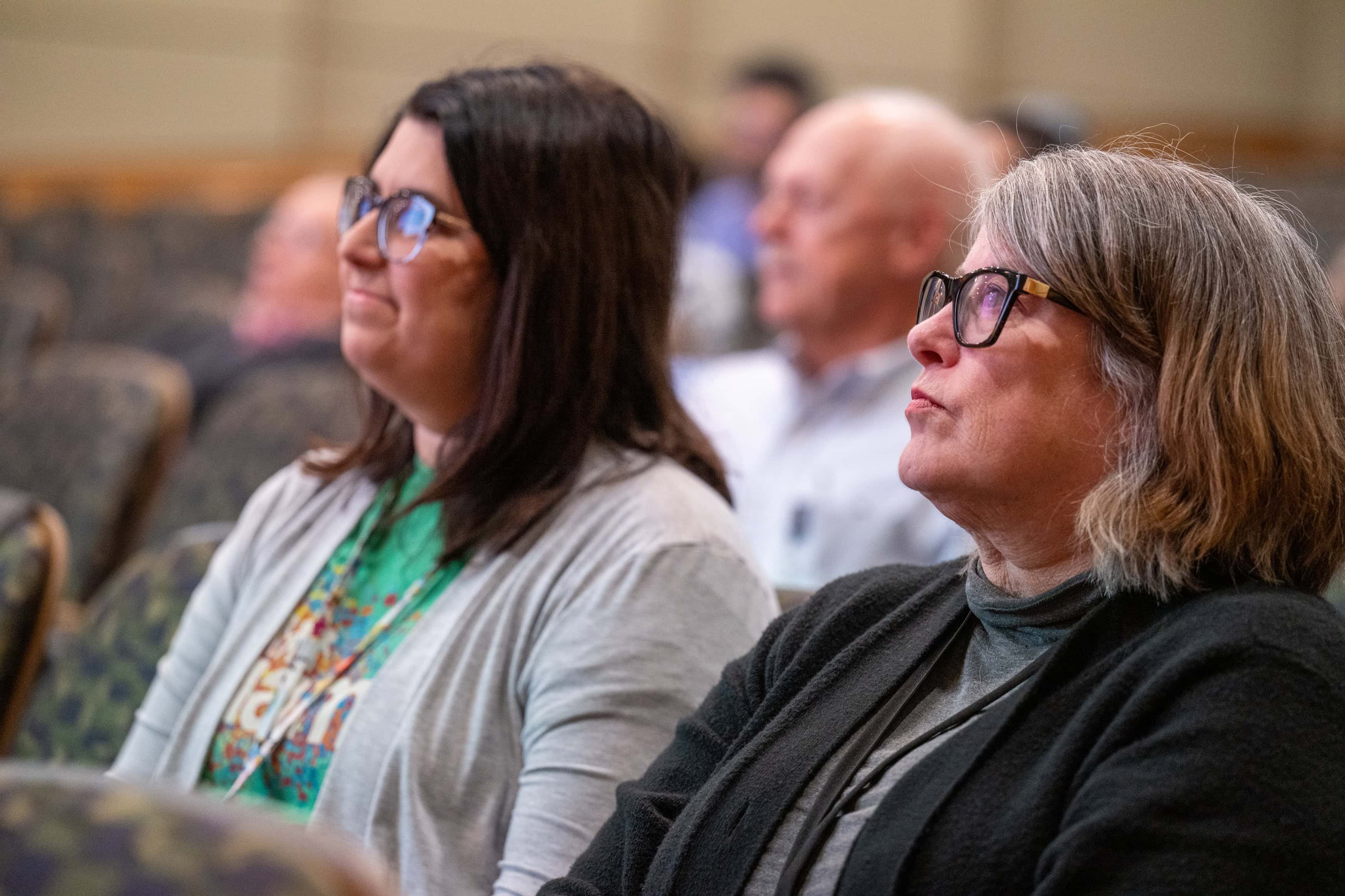 Faculty members listening in the audience