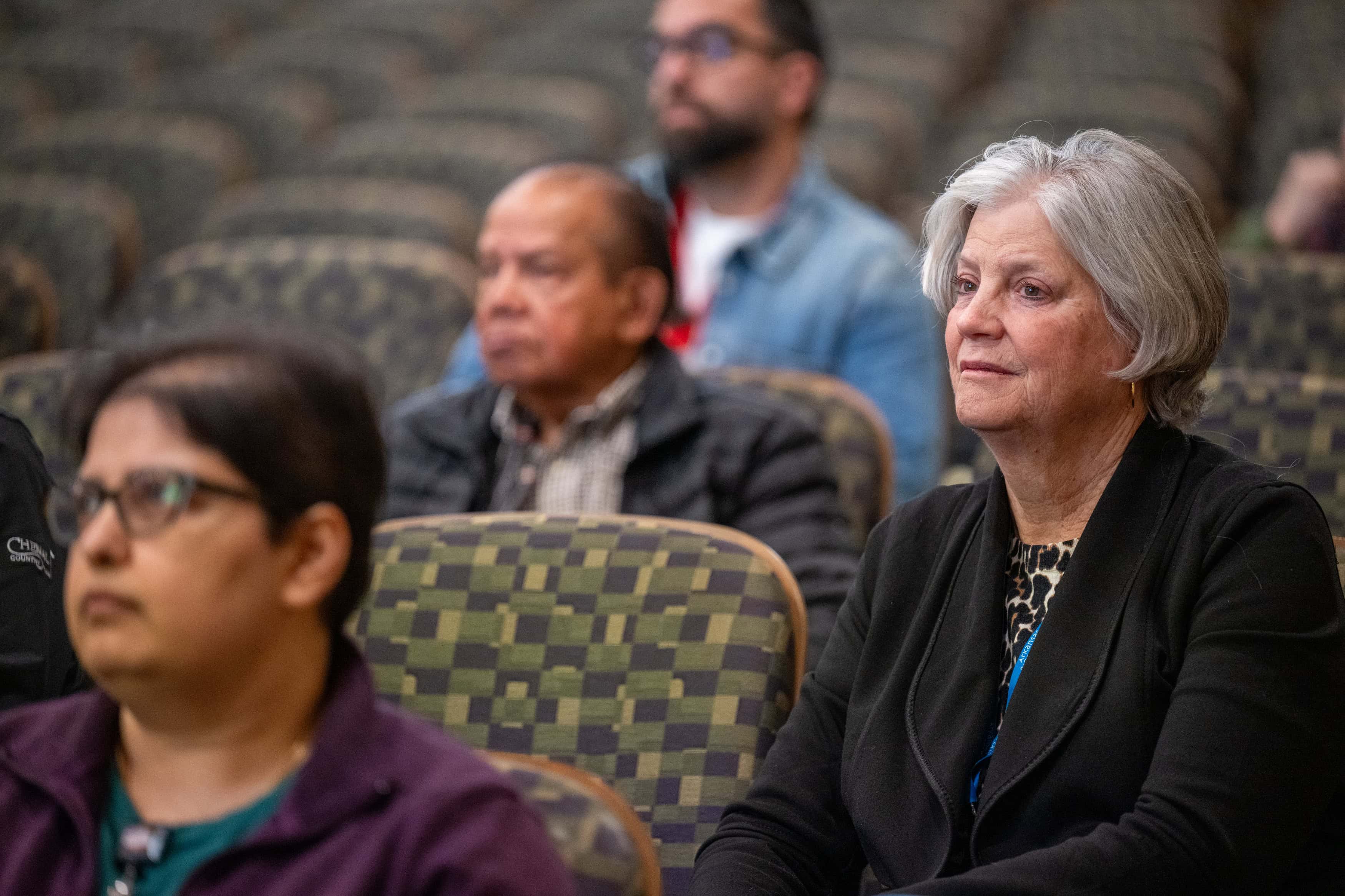 Faculty members listening in the audience