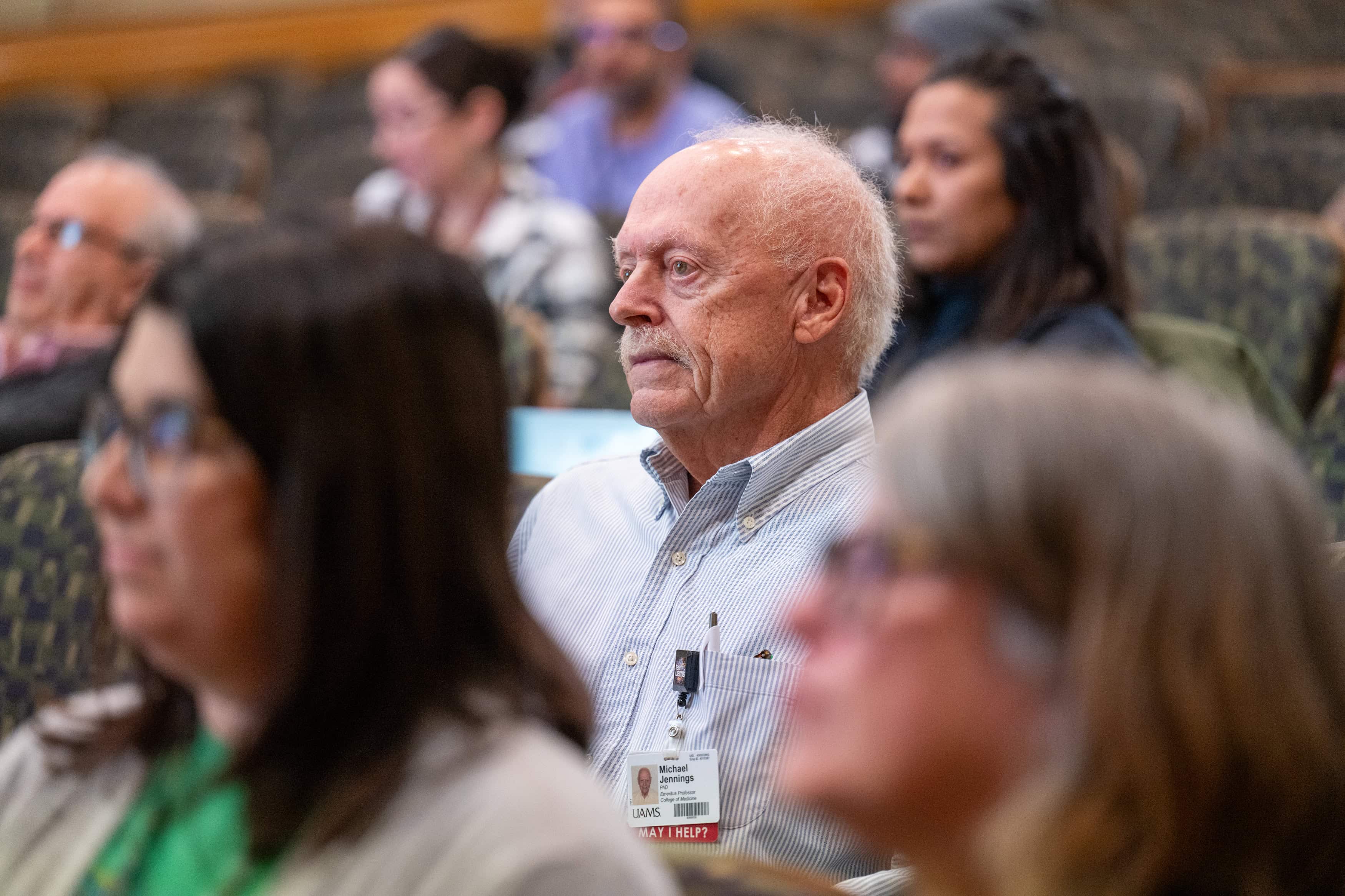 Faculty members listening in the audience