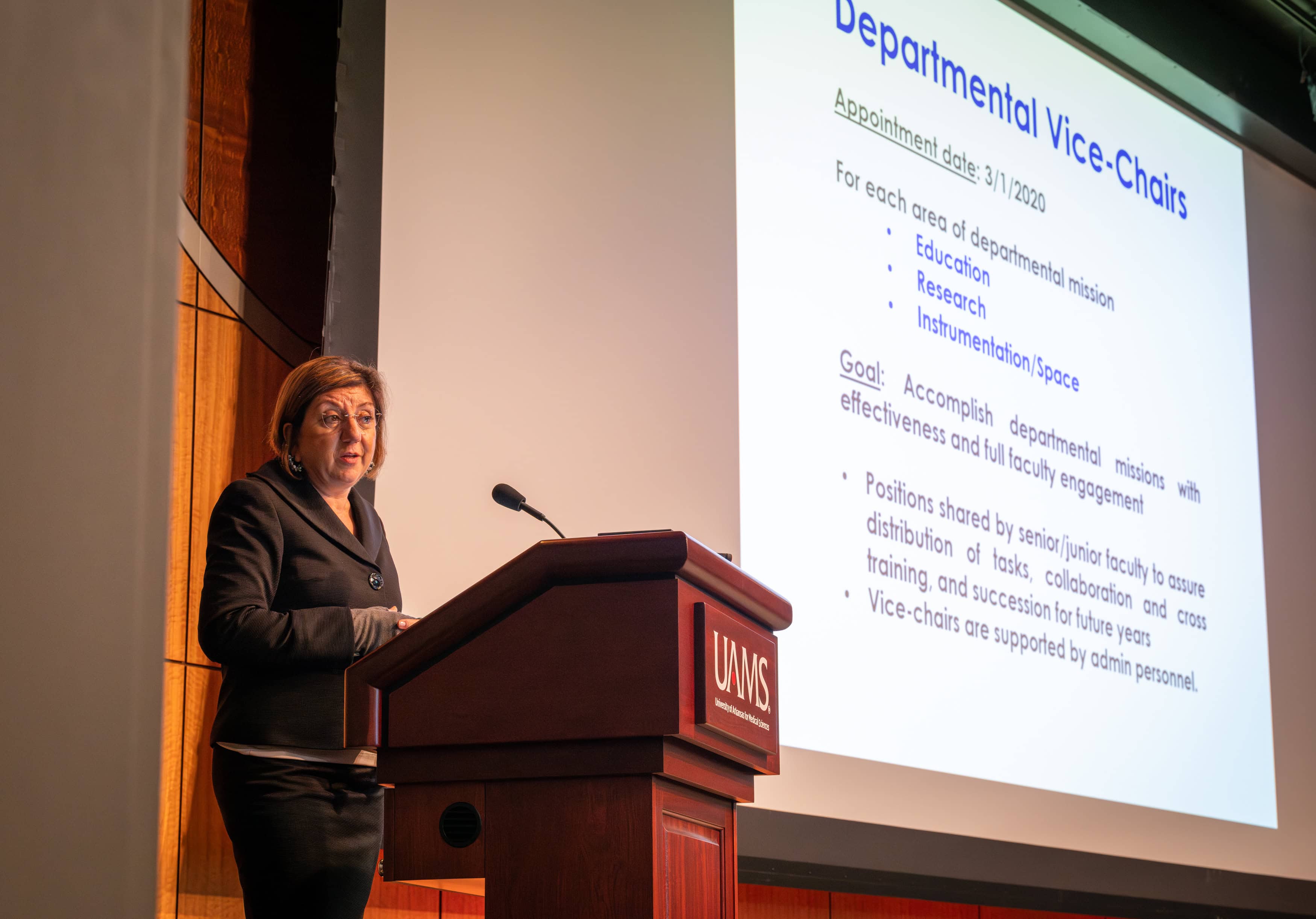 Dr. Bellido speaking at a lectern