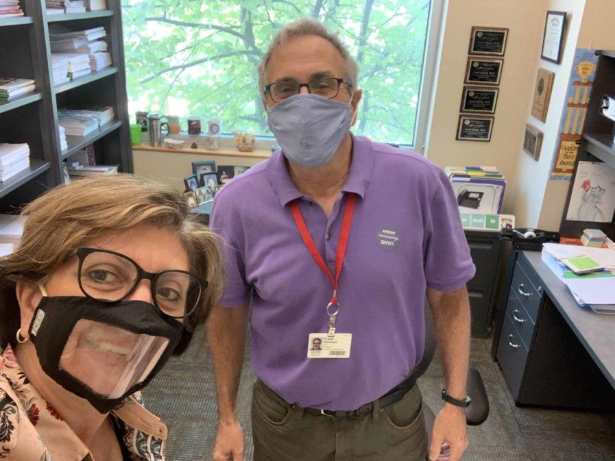 Dr. Bellido with Dr. Frank Simmen, wearing masks