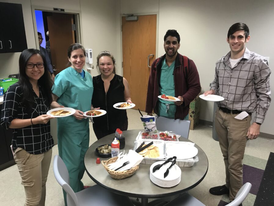 Residents in a breakroom for a pancake breakfast