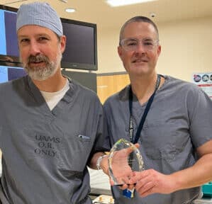 Physician is presented an award.