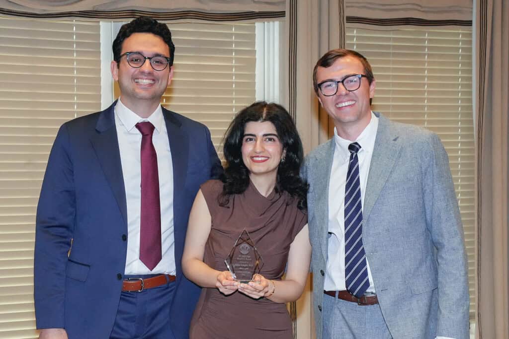 Photo of someone receiving an award.