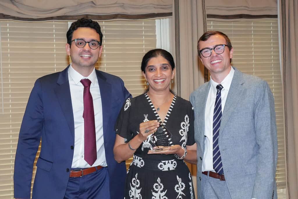 Photo of someone receiving an award.