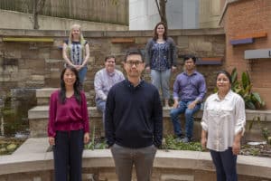 Justin Leung, Ph.D., (front and center with his team), a researcher with the Winthrop P. Rockefeller Cancer Institute, has been awarded a $1.47 million National Cancer Institute grant to study DNA. Image by Evan D. Lewis