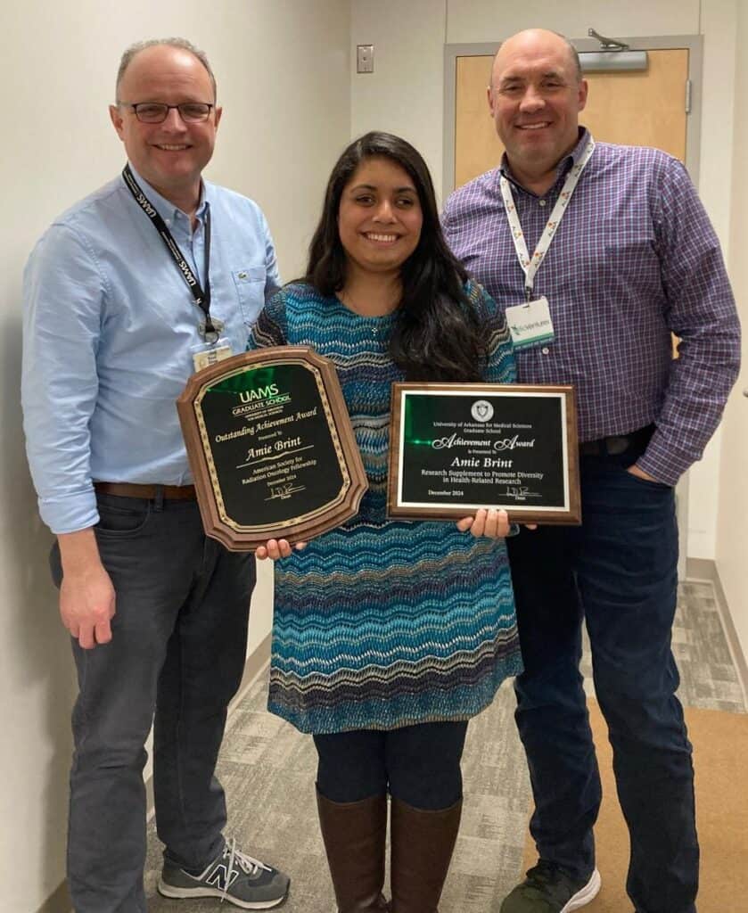 Amine Brint and Dr. Dings and Dr. Griffin presenting the awards they have earned