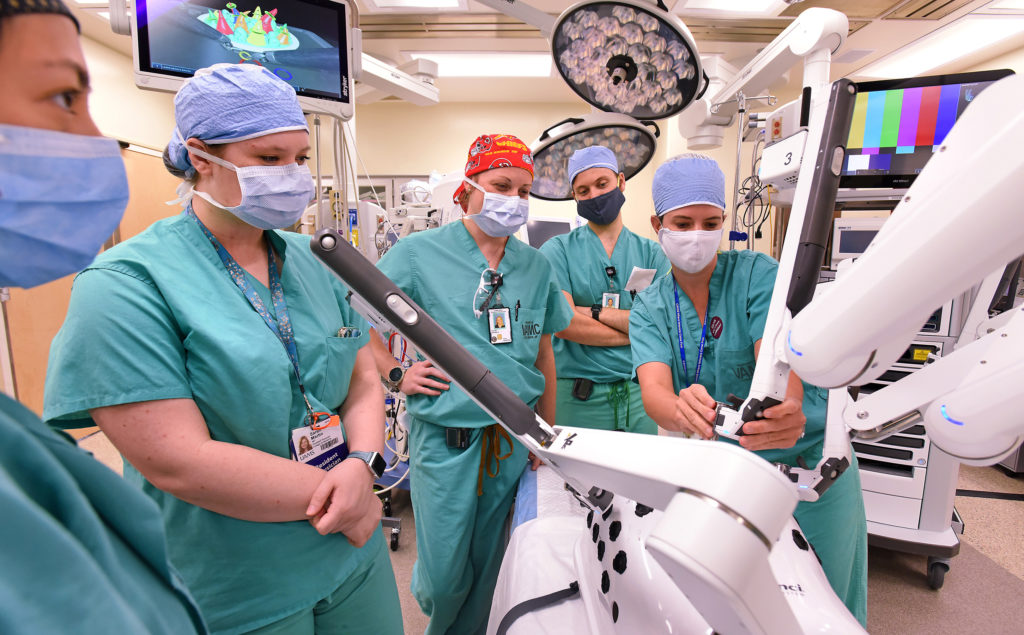 residents training on a DaVinci robotic surgery machine