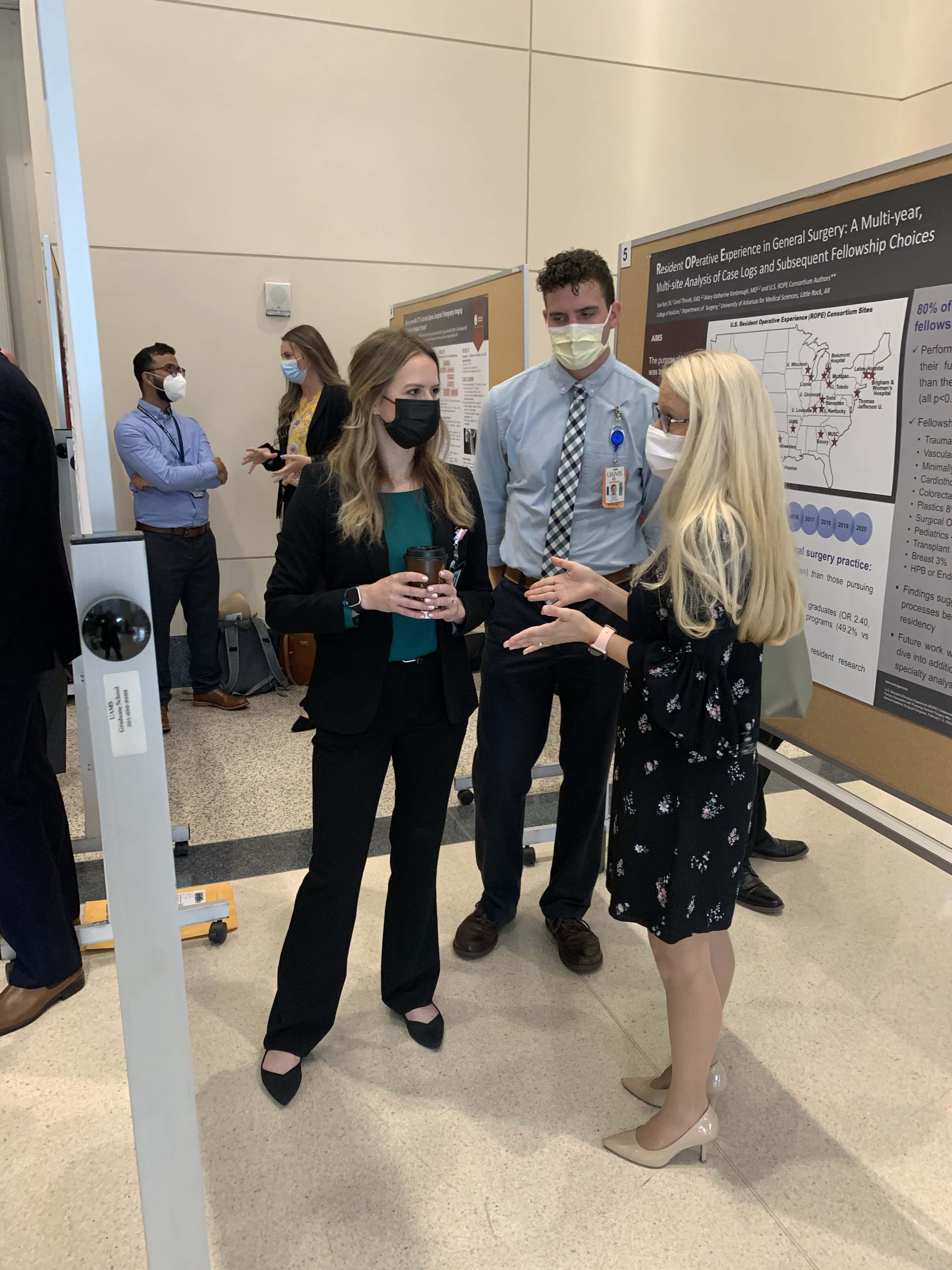Students discussing research posters