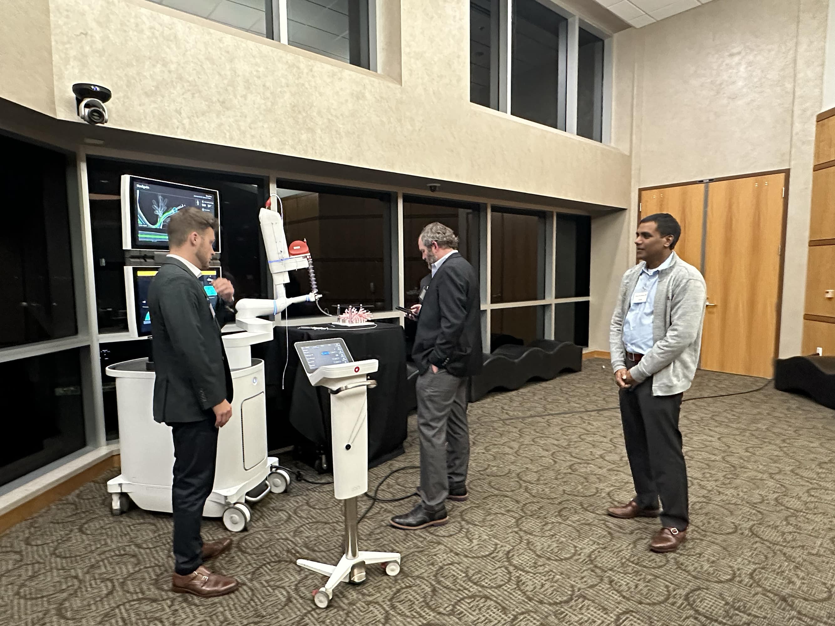 group of people looking at equipment