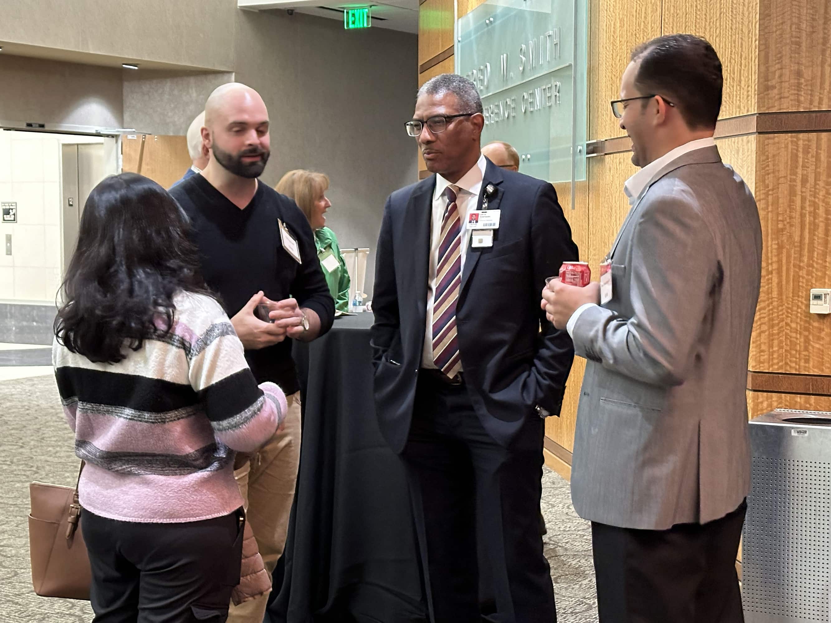 group of people talking at Chest Club