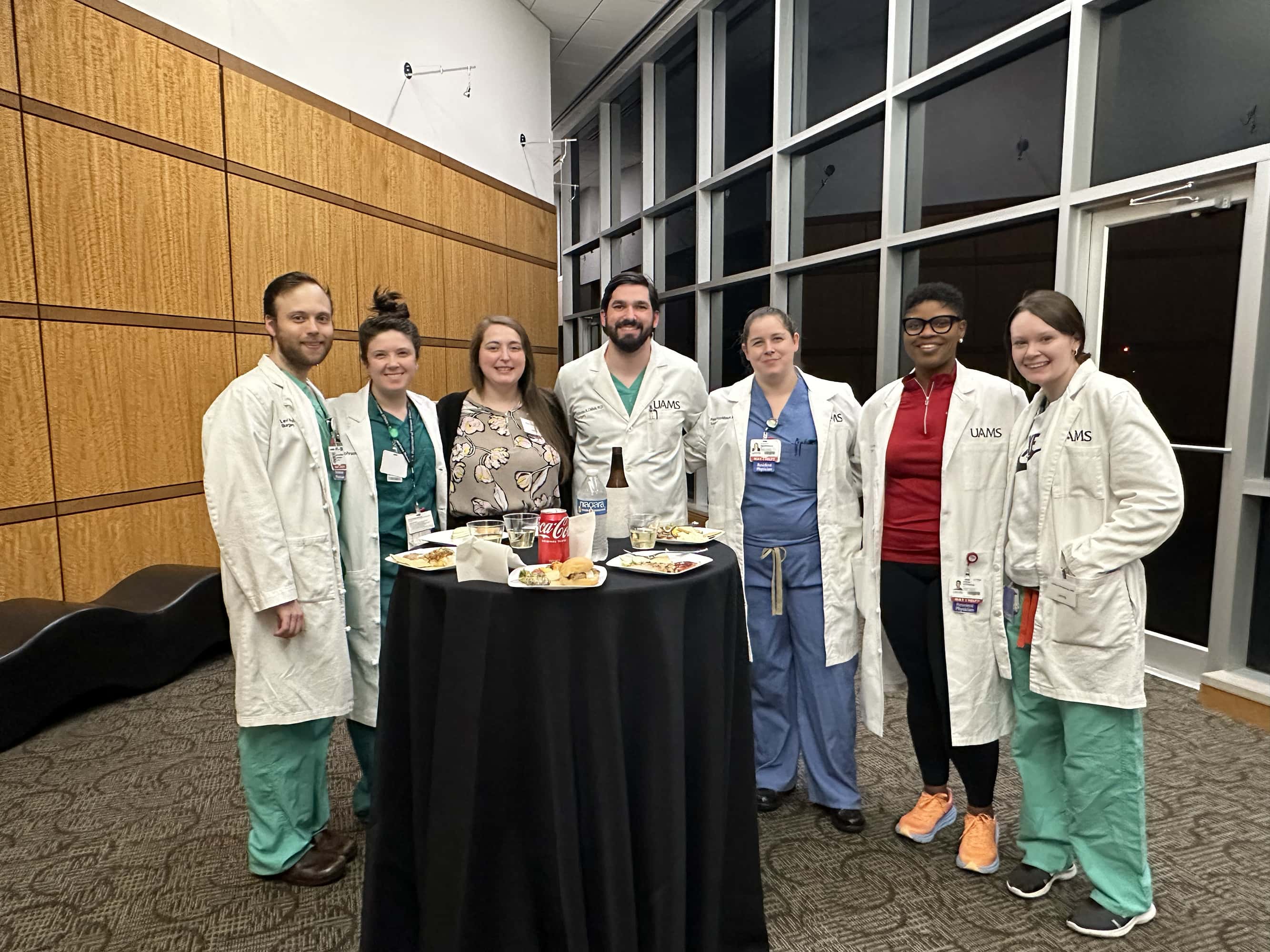 group of people talking at Chest Club
