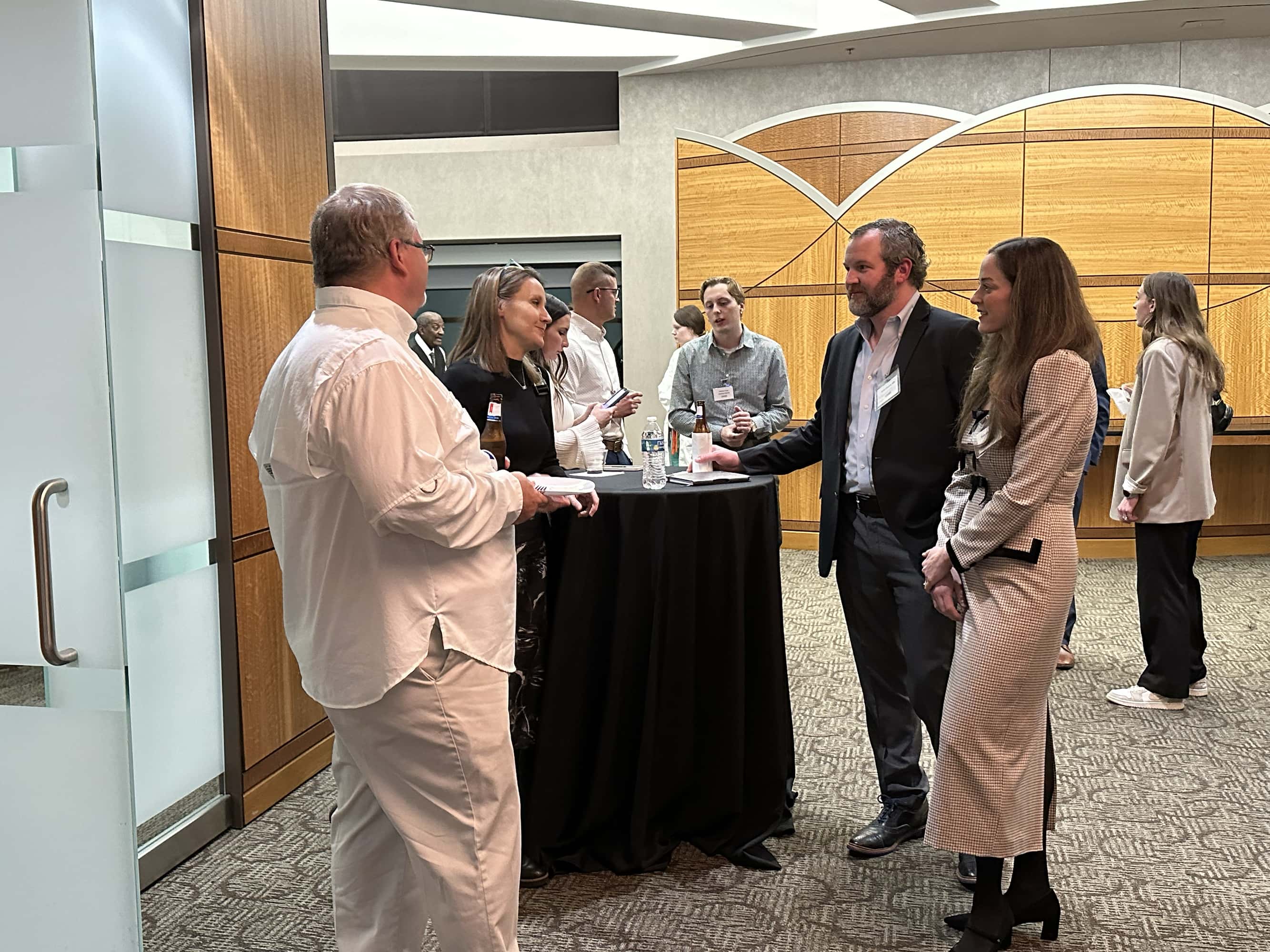 group of people talking at Chest Club
