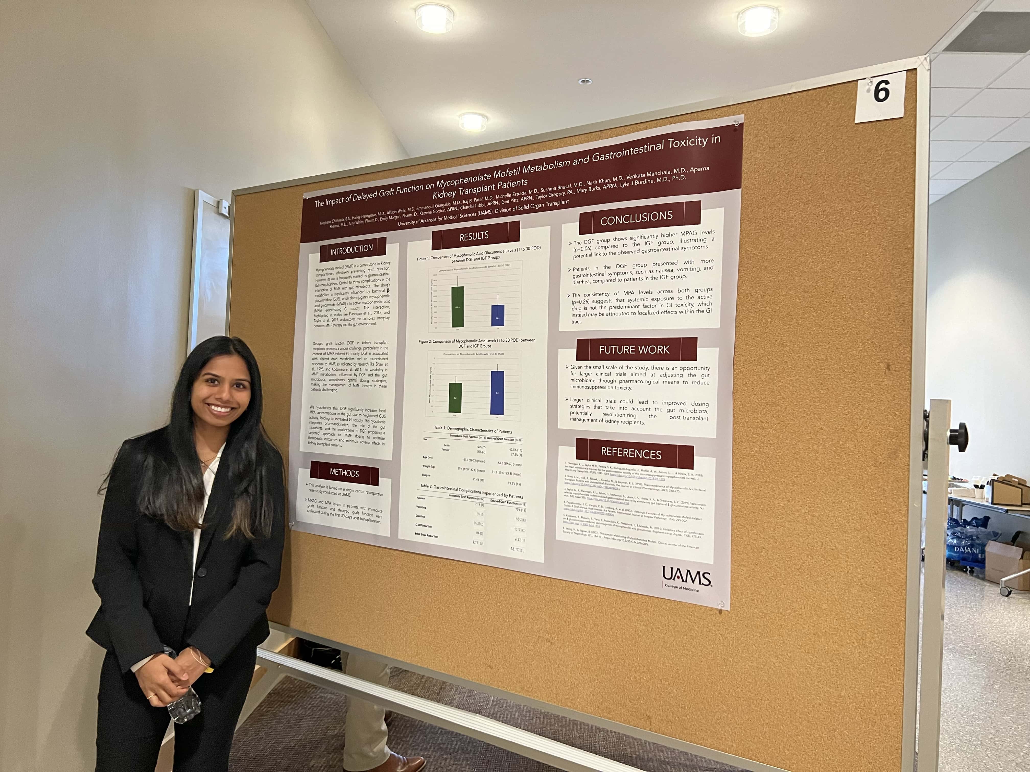 Student with research poster