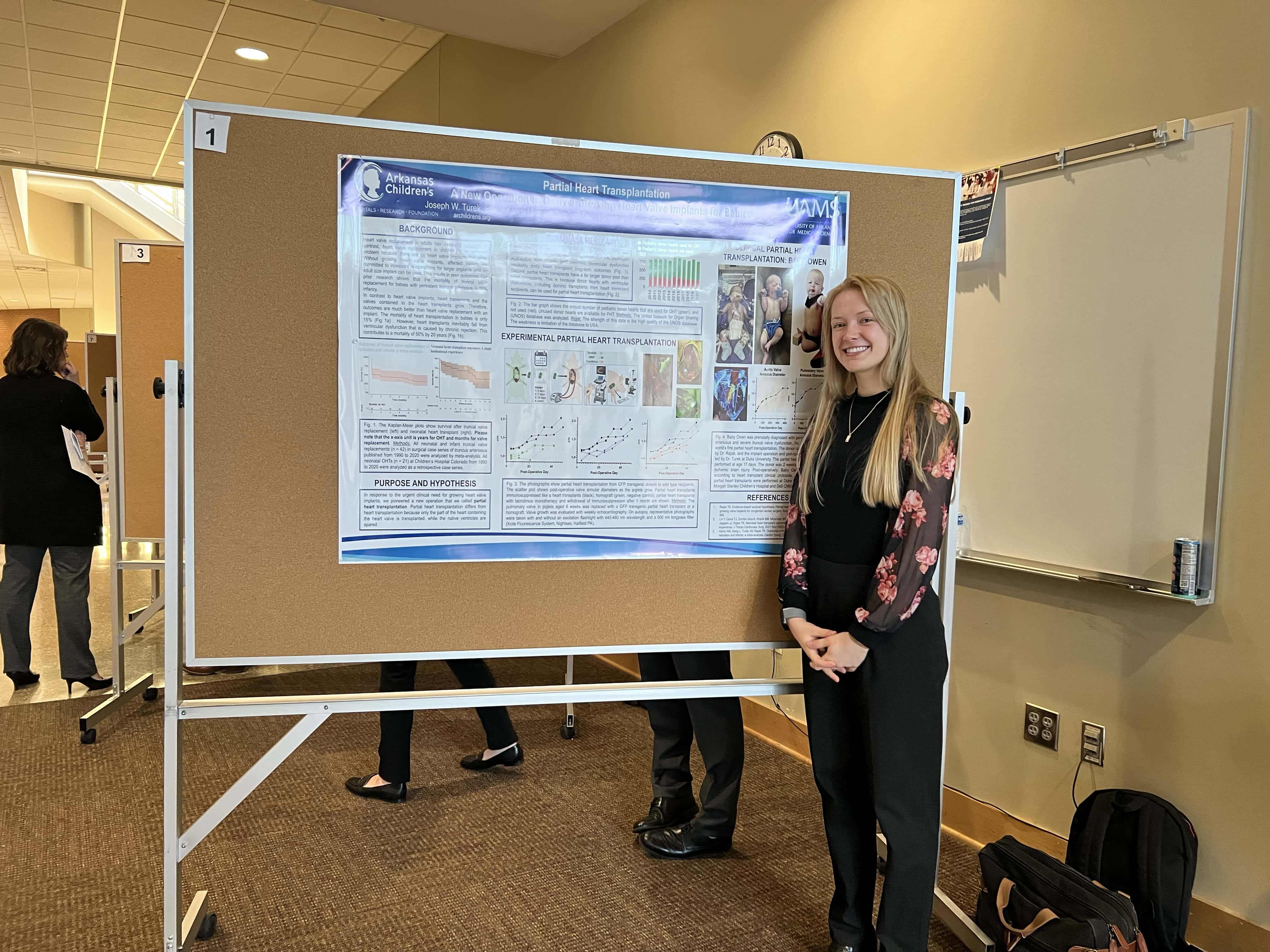 Student with research poster