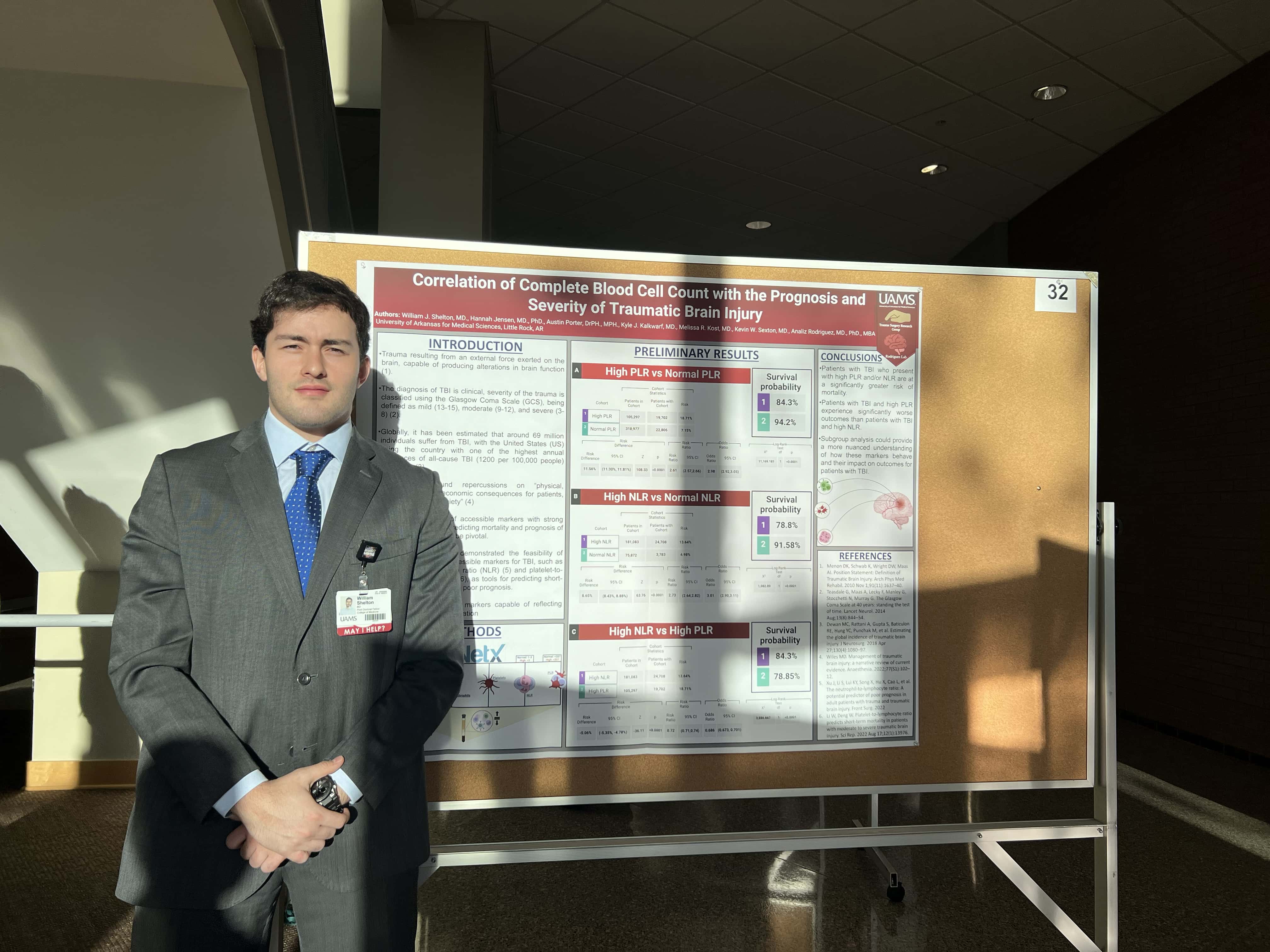 Student with research poster