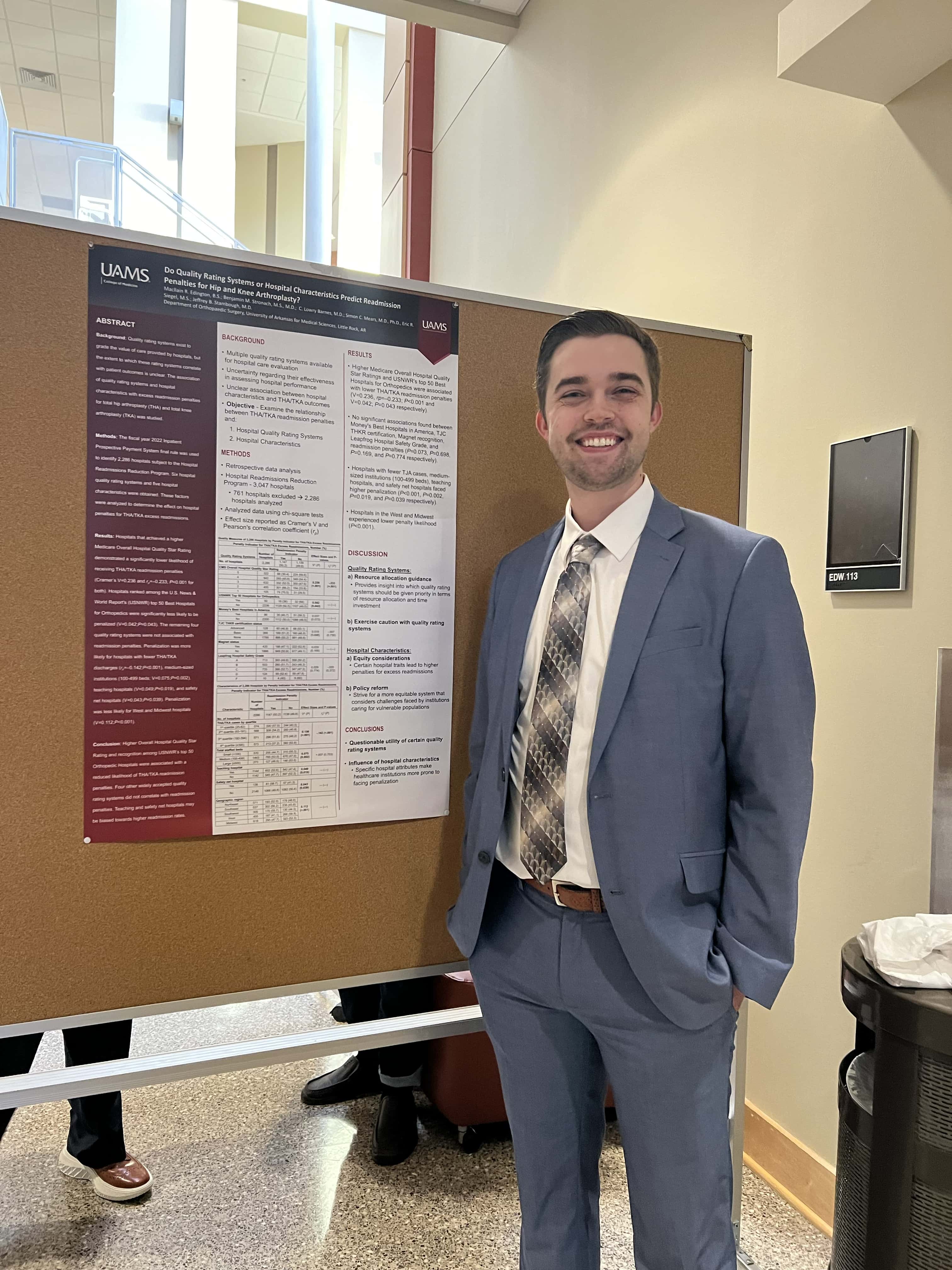 Student with research poster