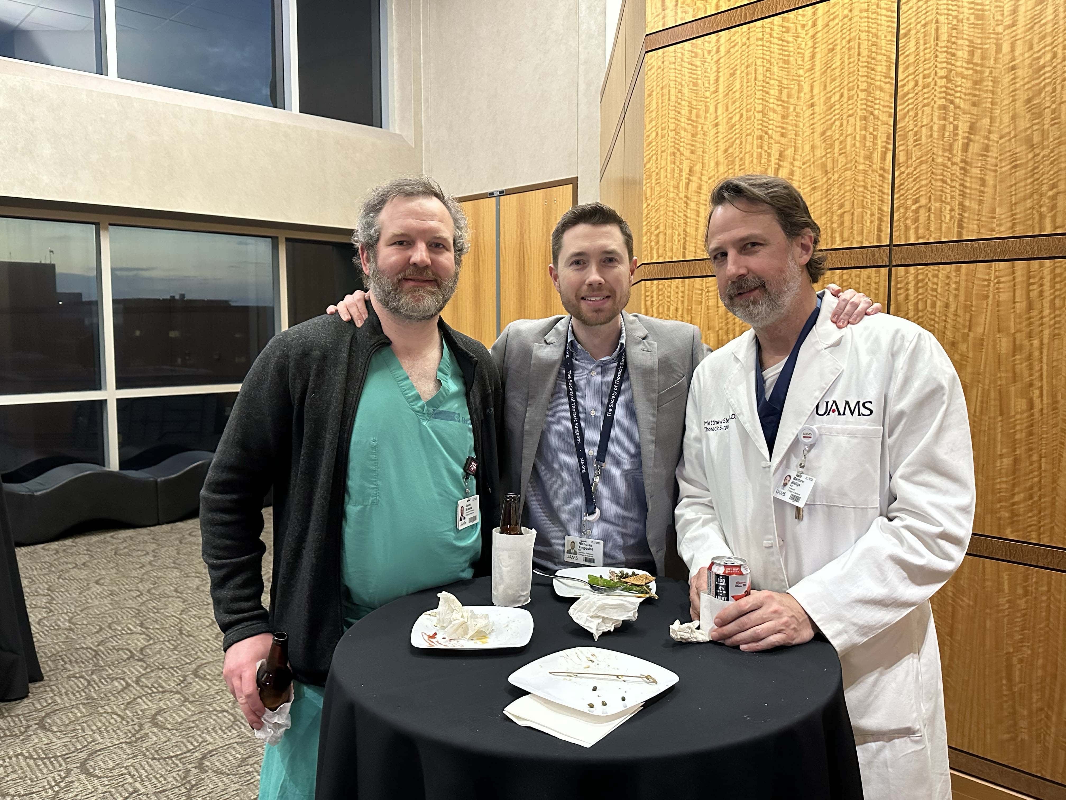 Group of faculty members posing at a reception