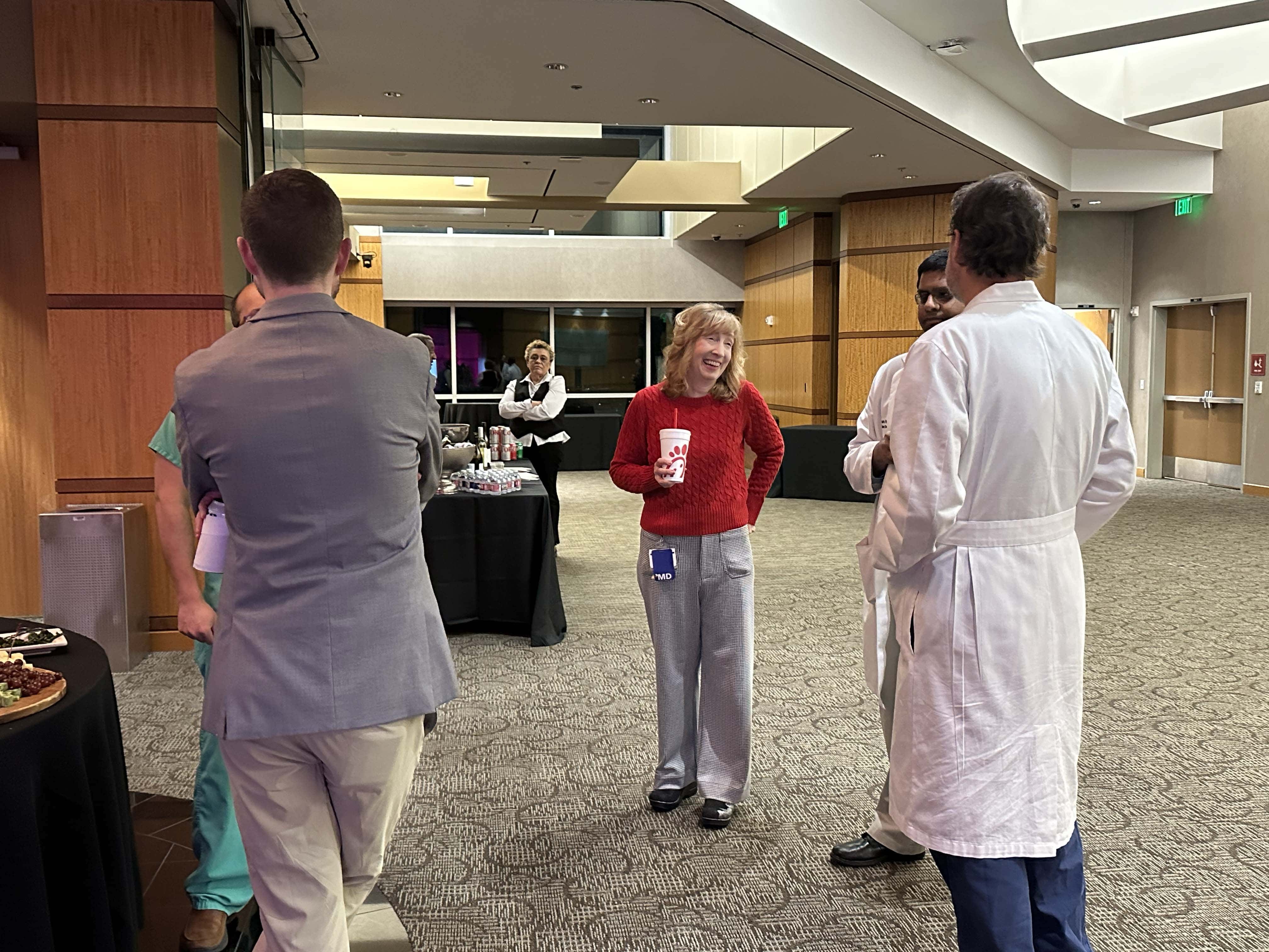Faculty members chat at the Chest Club meeting