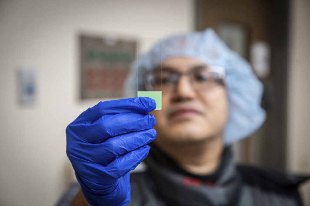 A doctor looking at a slide
