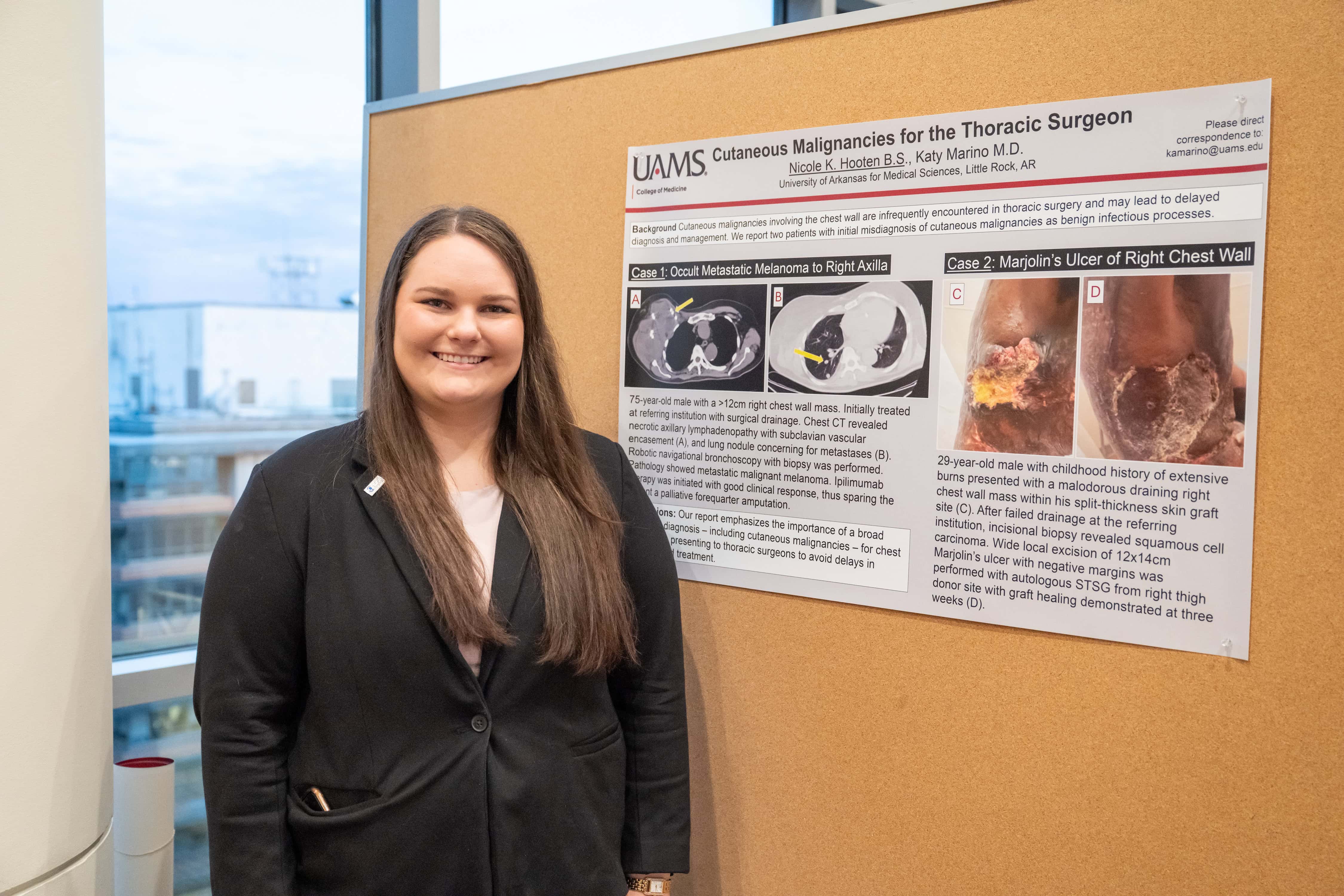 Nicole Hooten in front of her presentation