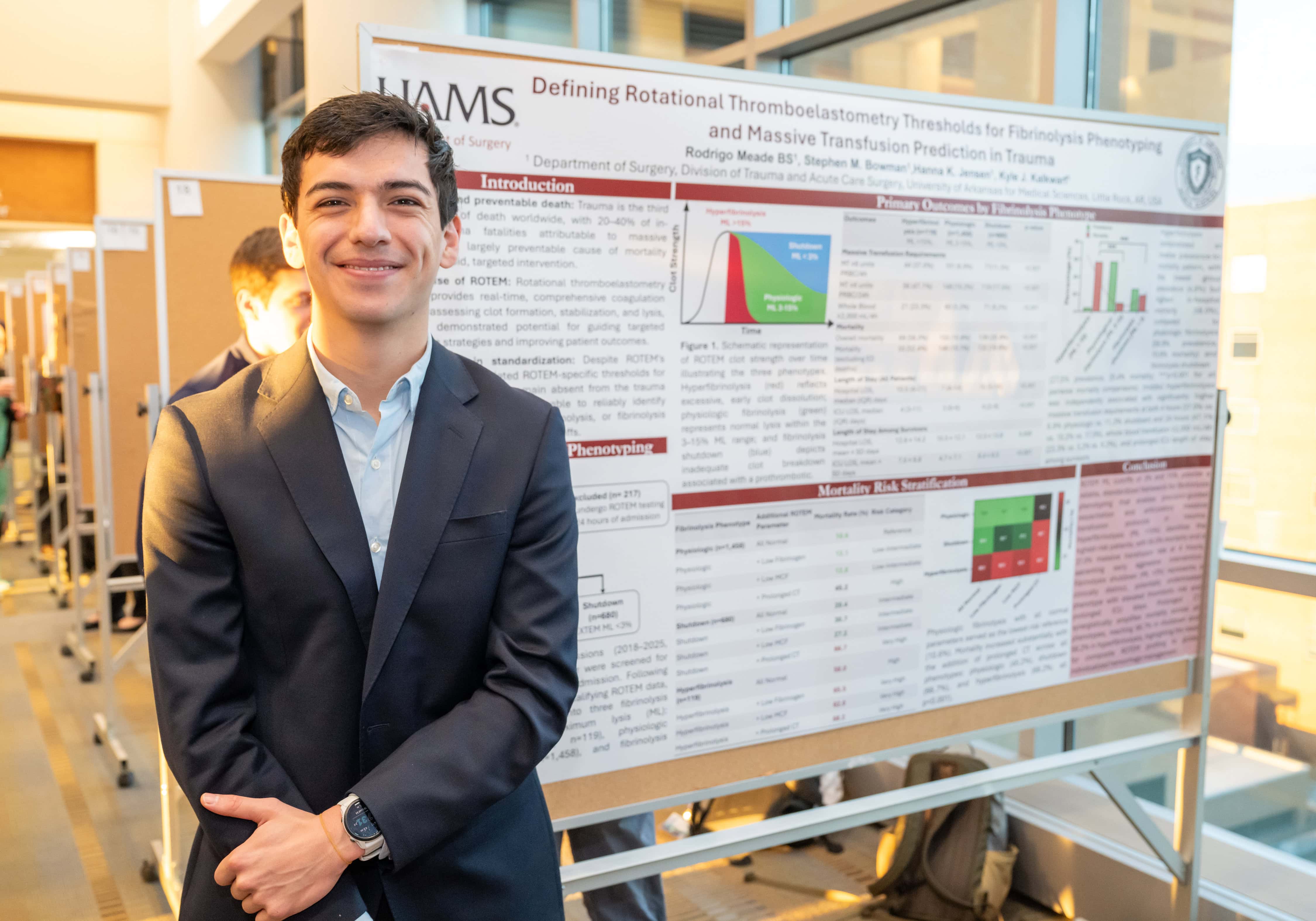 Rodrigo Meade standing in front of his presentation