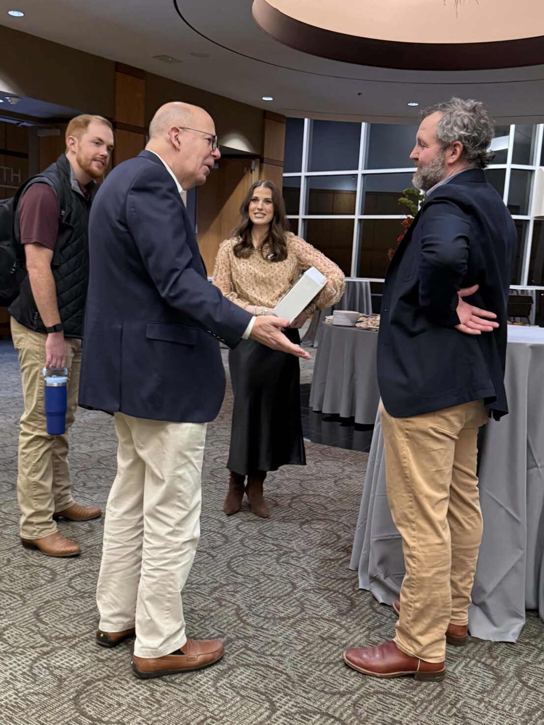 group of people talking in the lobby