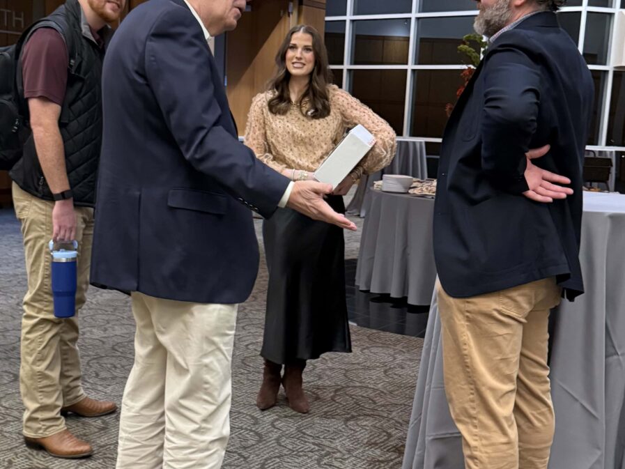 group of people talking in the lobby